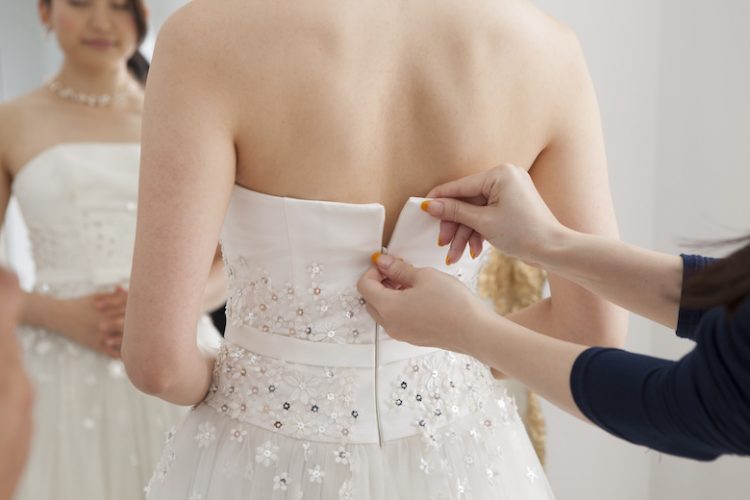 Bride is asked to dress the wedding dress for women