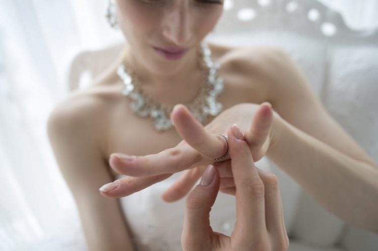 The bride wears a happily wedding ring